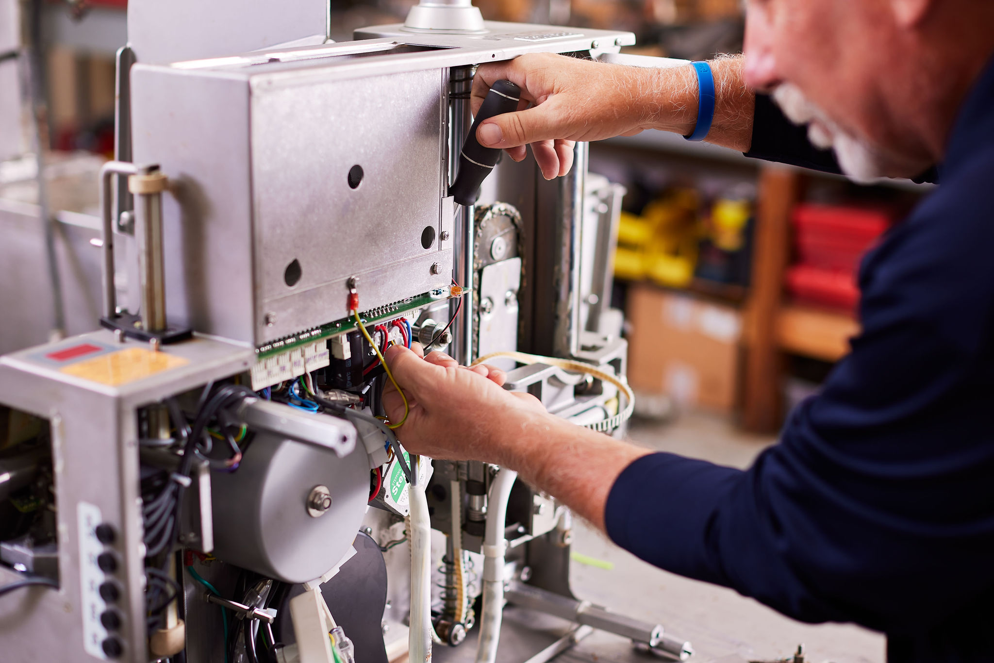 Man working a meat machine from Hess Meat Machines