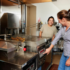 commercial food service equipments consultants from Hess Meat Machines inspecting equipment