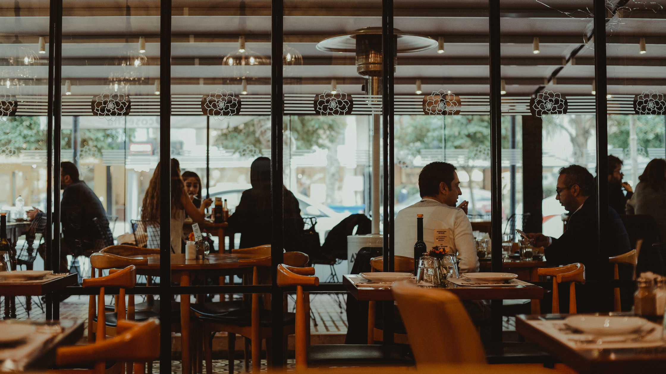 Customers enjoying meals in a restaurant.