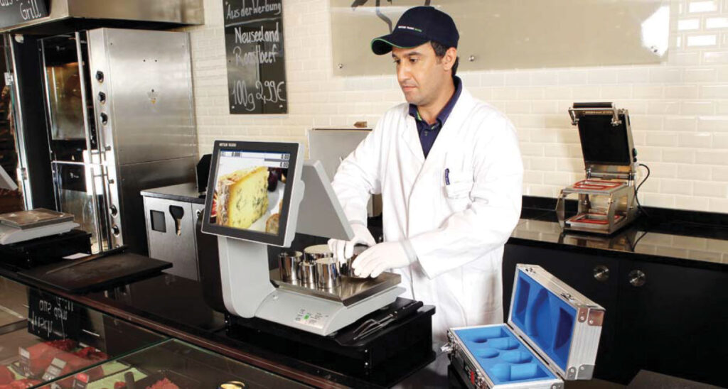 Man Using Mettler Toledo Scale From Hess Meat Machines
