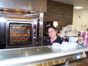 Employee From Karsch's Village Market Using Hess Meat Machines' Commercial Combi Oven